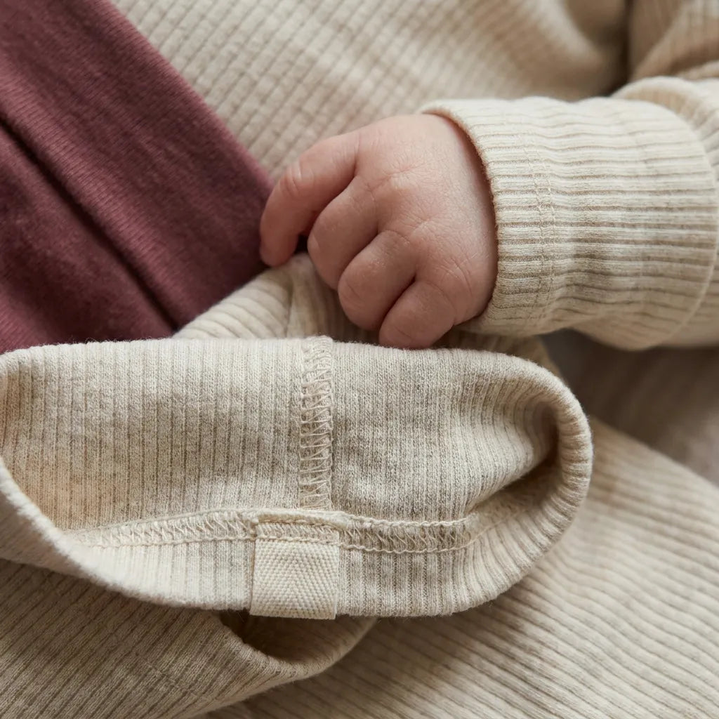 Soft baby clothes in neutral colours